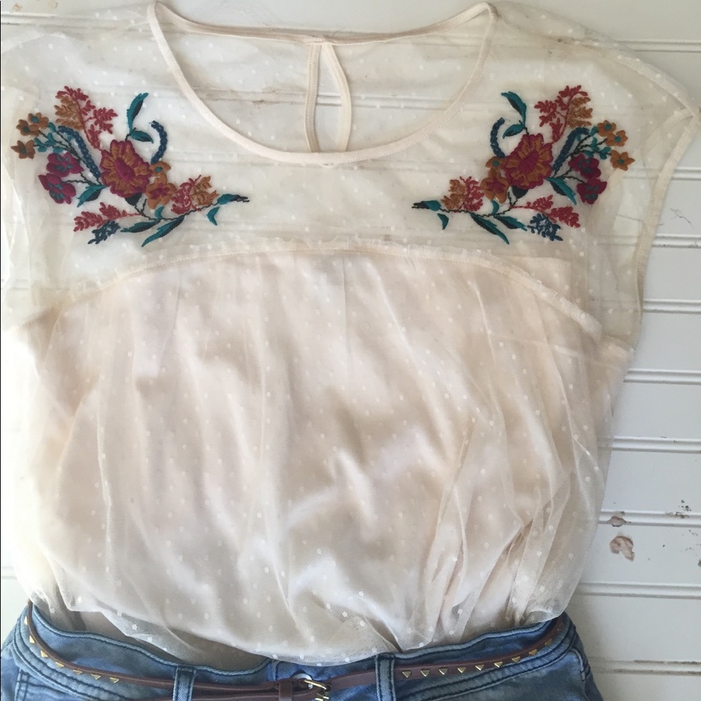 Cream sleeveless blouse